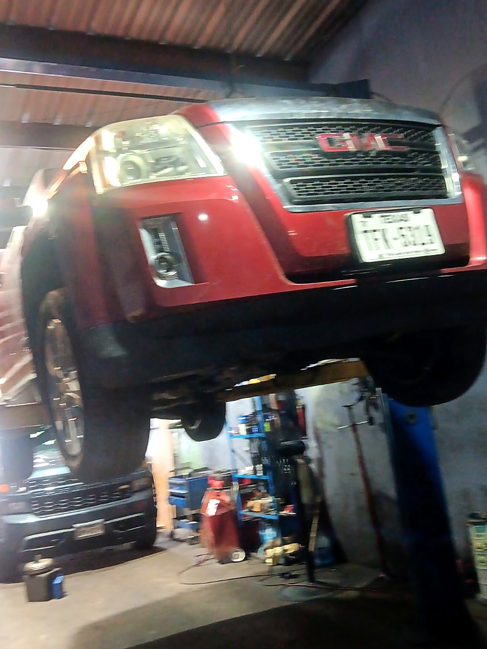 Workshop with vehicle on lift
