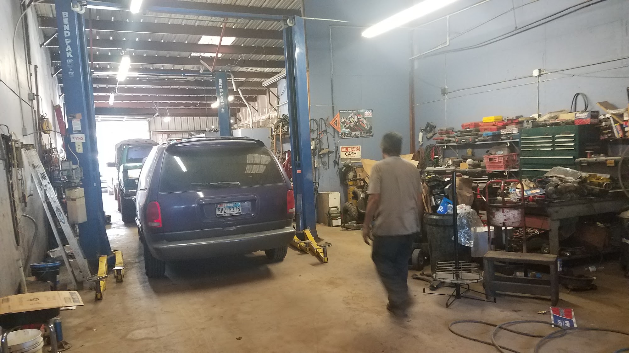 Workshop with vehicle on lift